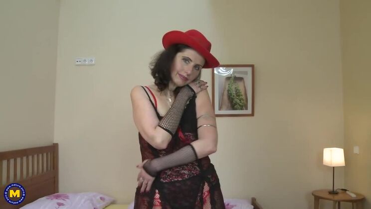 Sexy mature woman plays with her body