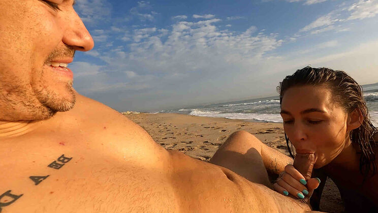 Amelia Gives Diego a Blowjob in Public on the Beach